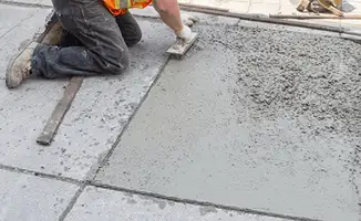 Professional repairing a concrete floor in Cleveland, OH