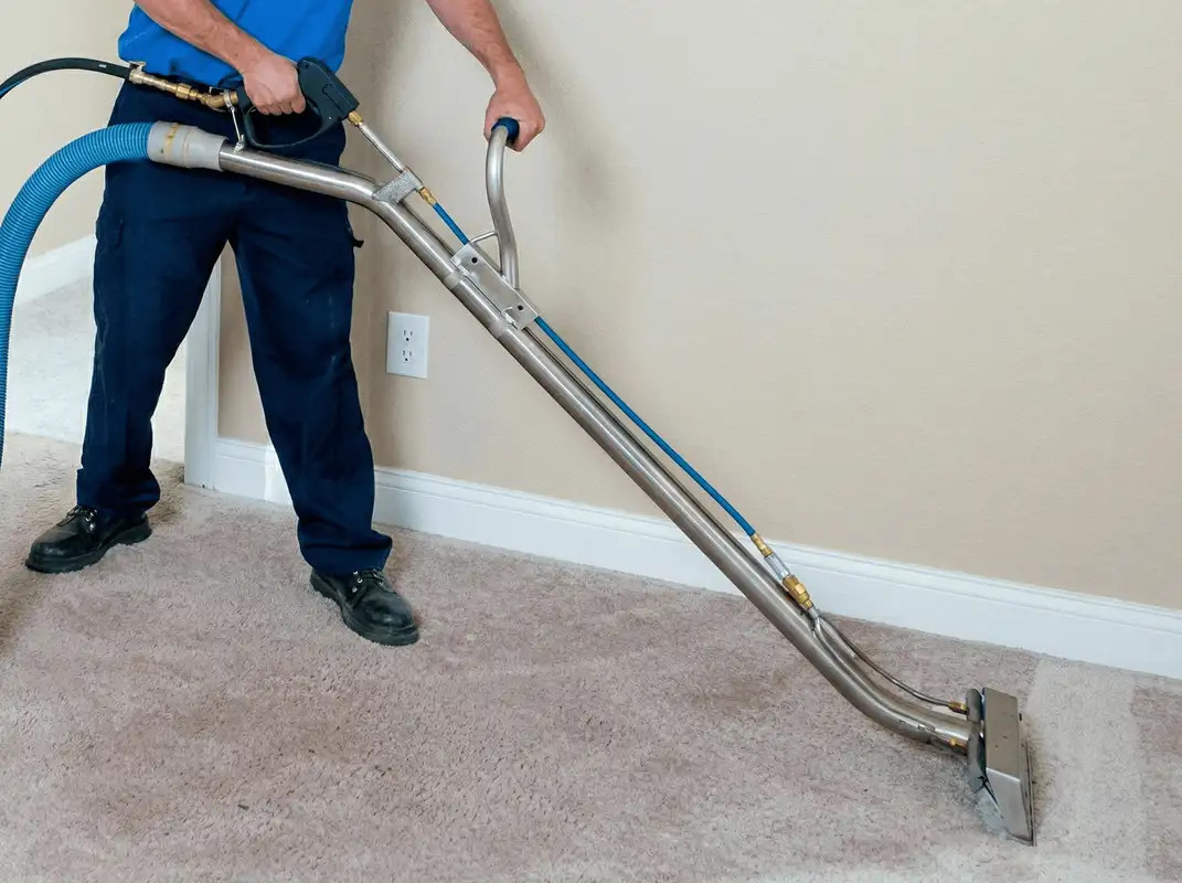 Professional operating a liquid removal machine on a carpeted floor in Cleveland, OH